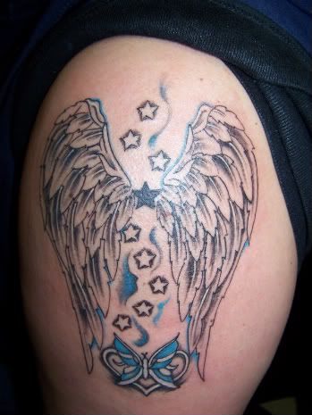 sterren tattoo. een vlinder en 9 sterren,